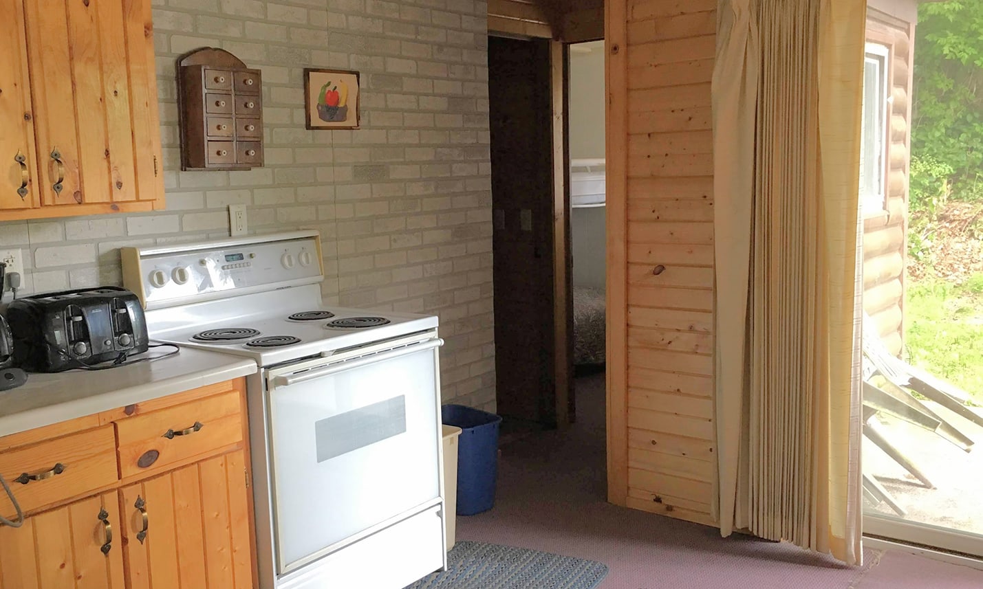 Camp Lacupolis Cabin Kitchen and Fridge